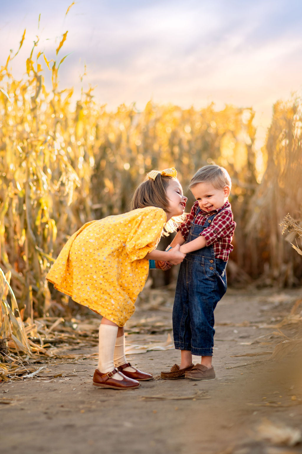 Maze Little Kids Laughing Kiss on Cheek